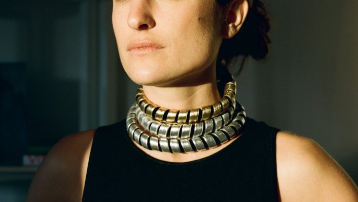 Maria Sole Ferragamo in SO LE studio wearing sustainable jewellery with black background