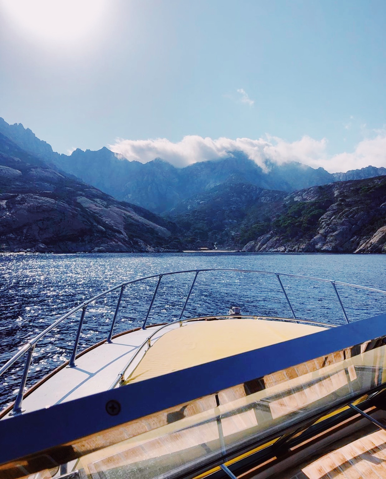 View of Montecristo mountains and blue sea from a boat in Tuscany in Italy