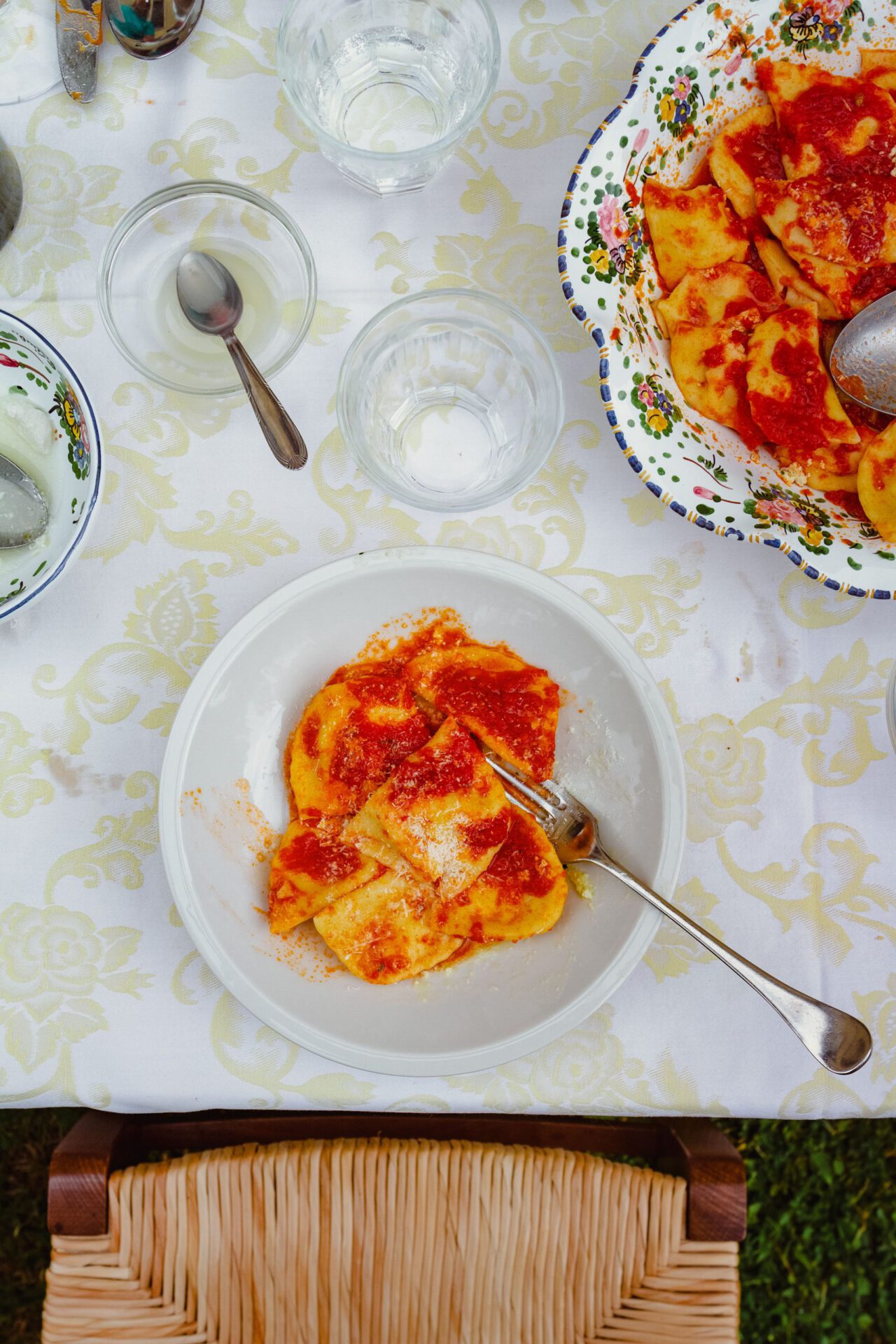 Italian pasta in red sauce over a white table in the countryside of Abruzzo in Italy