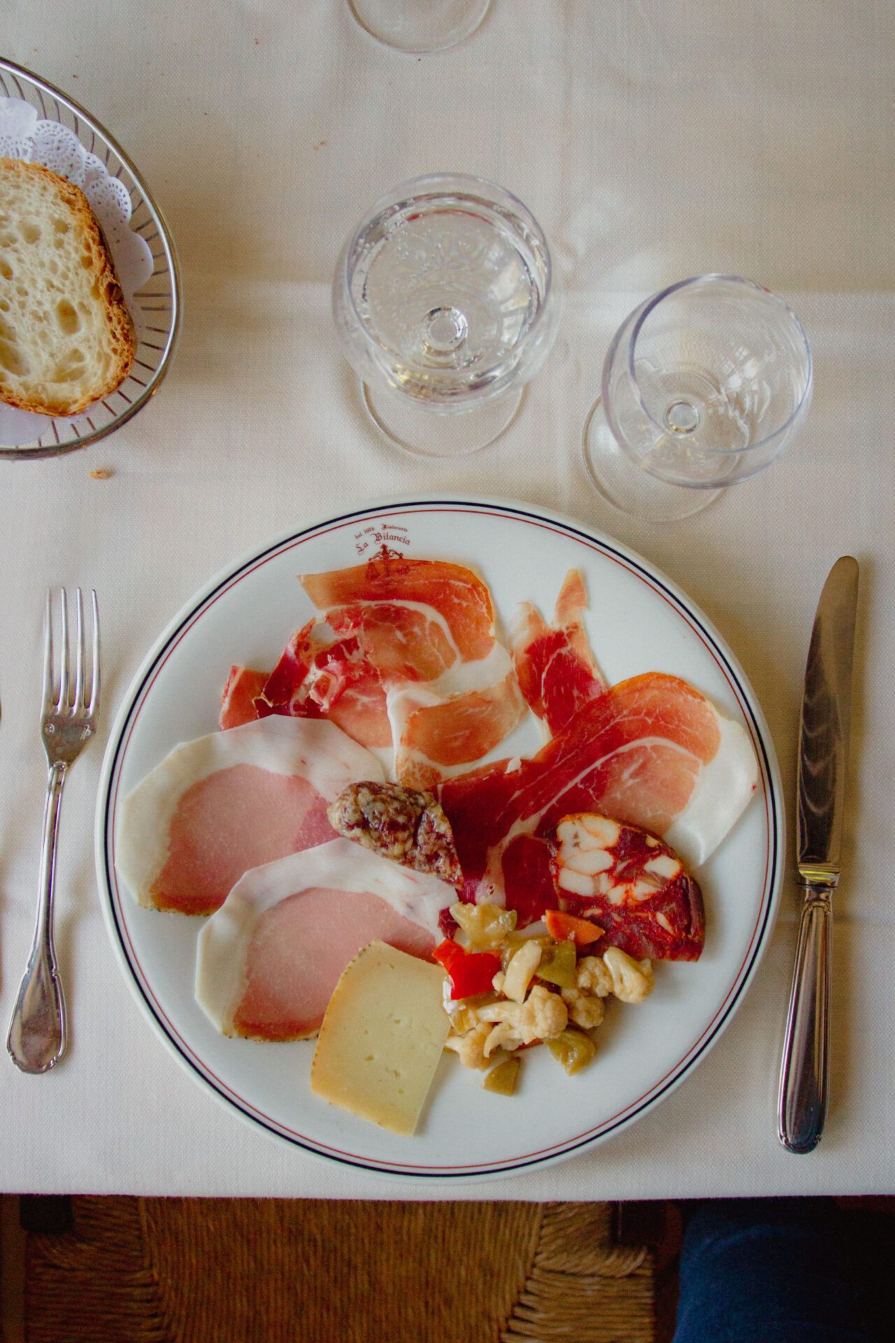 Italian breakfast with prosciutto ham cheese dried fruits over a white table in Abruzzo in Italy