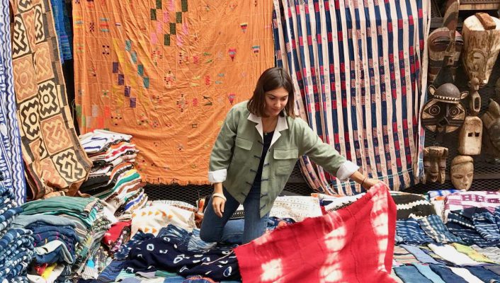 Pia Zanardi with and over colorful fabrics in Yali Tribe