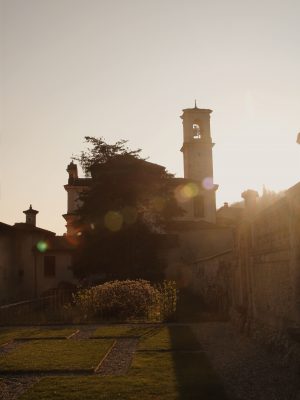 Sunset plants and buildings viewed from square of villa Bozzolo from Varese in Lombardy Italy