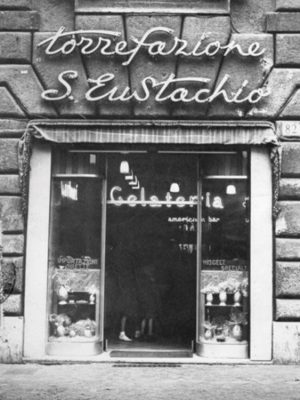 Sant Eustachio caffè door and building in roman street in Italy Black and White