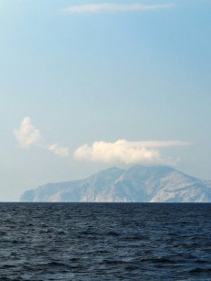 Monte Cristo poking up out of the dark blue sea