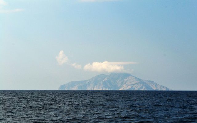 Monte Cristo poking up out of the dark blue sea