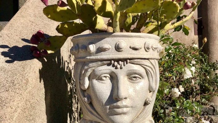 Rock head pot with cactus inside in a italian Villa at Sicily Italy