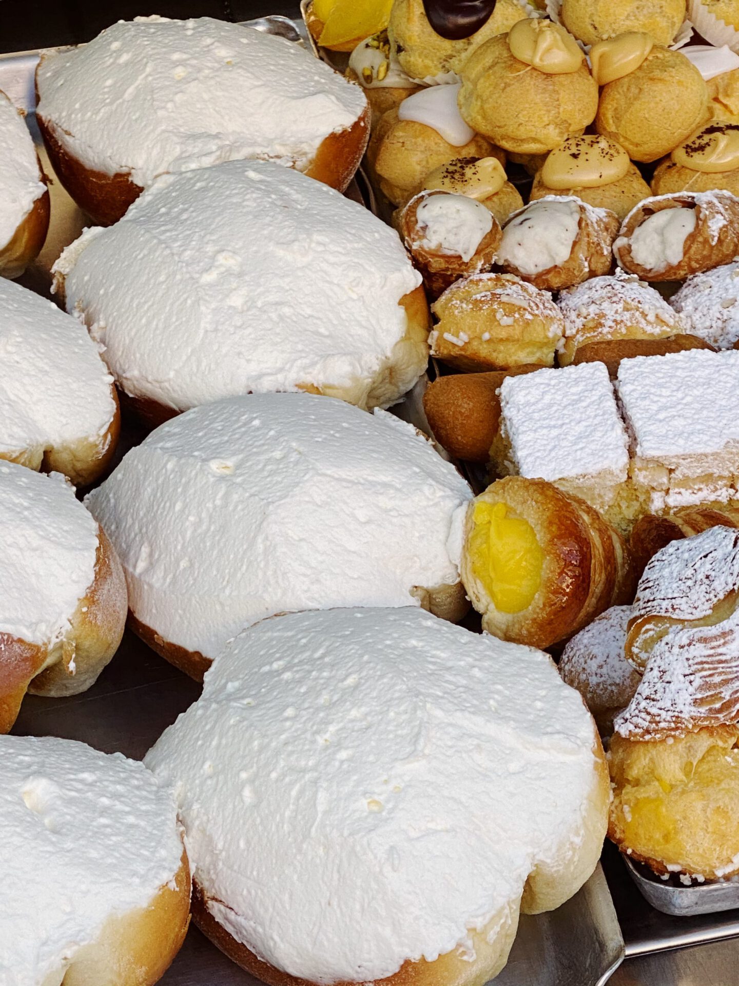 Maritozzi and pastries in the counter at Regoli Pastry Shop in Rome Lazio in Italy