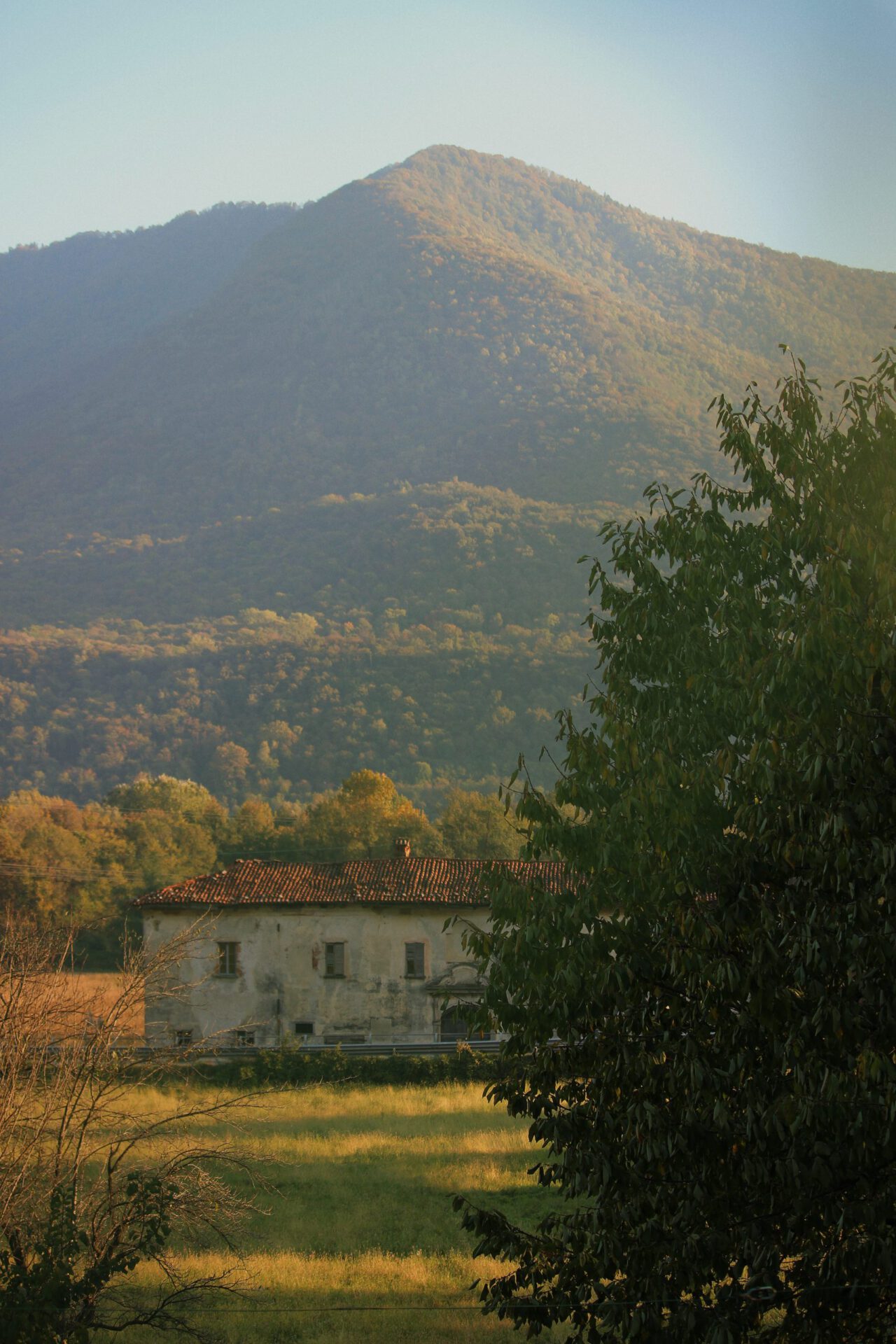 Antique house submerged in a mountains and plants landscape in the countryside of Valcuvia in Varese Lombardy in Italy