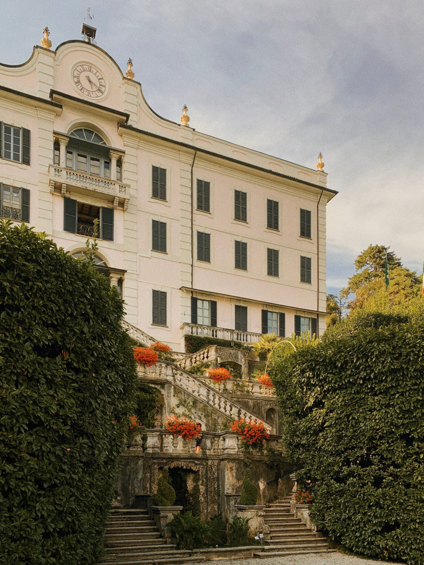 Antique building surrounded by plants and geometric gardens of Villa Carlotta in Tremezzo Lombardy in Italy