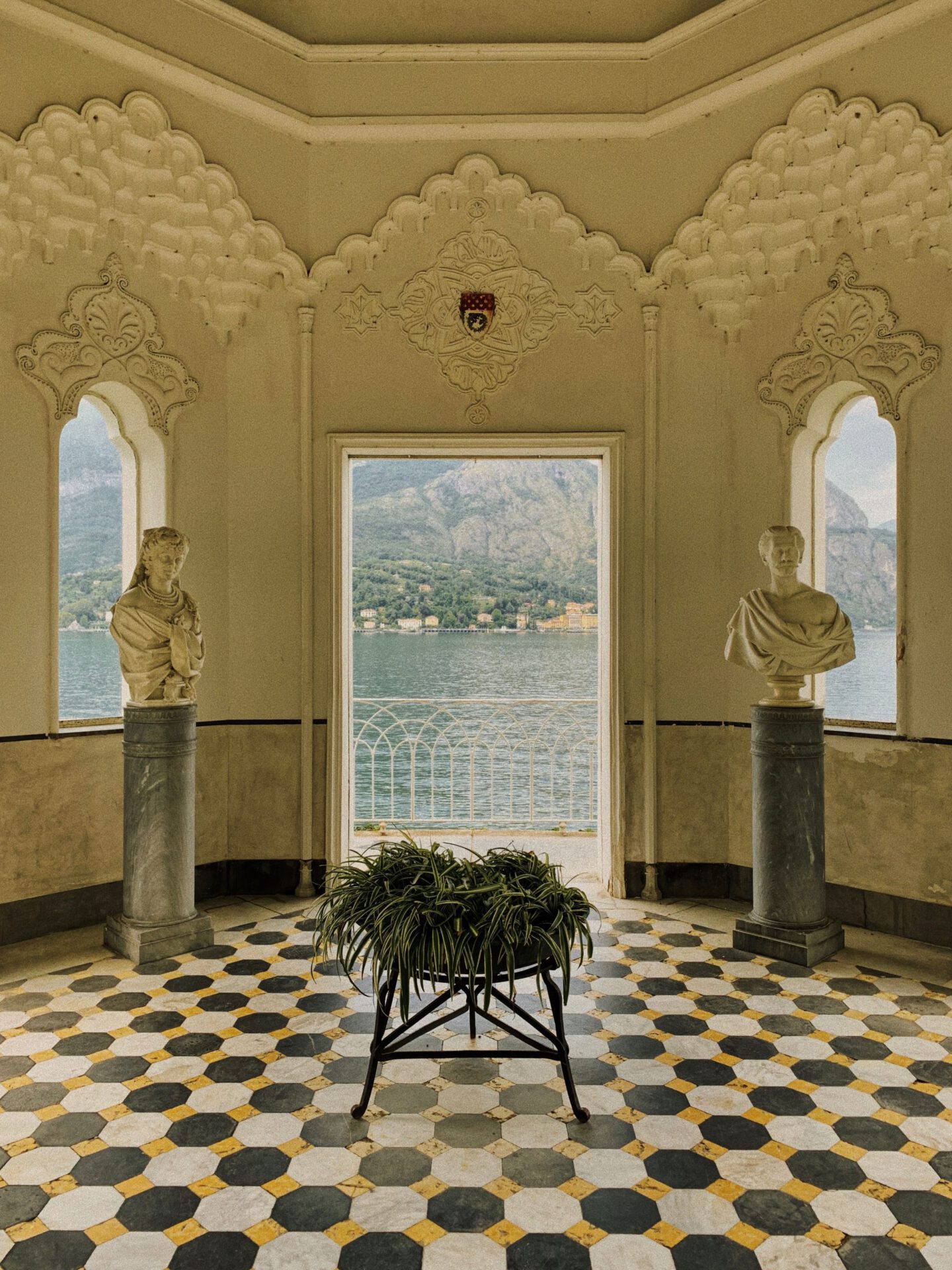 Antique saloon with sculptures in marble white walls and geometric floor of Villa Melzi in Bellagio Lombardy in Italy