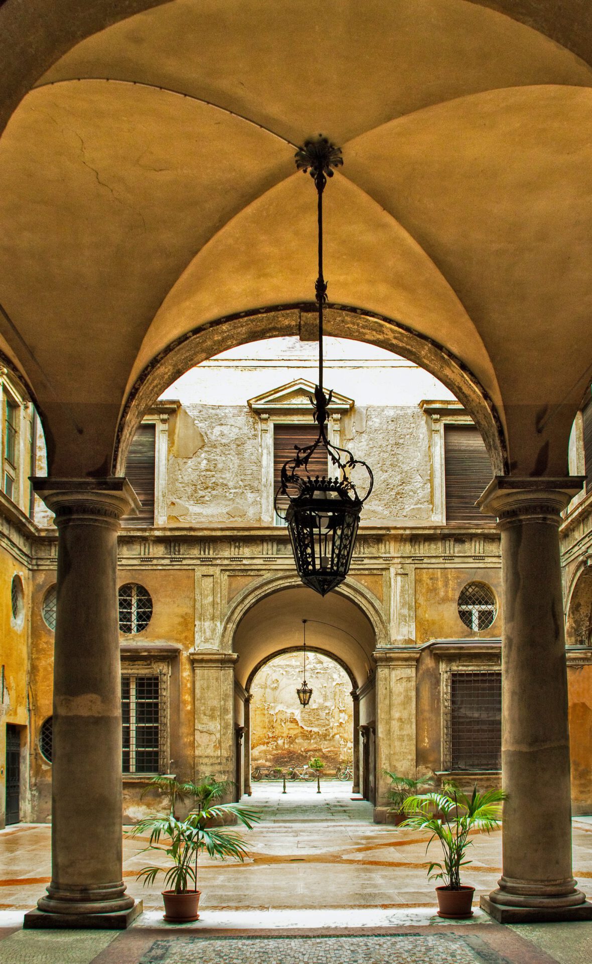 Inside of an old and historic building with antique style columns and roof in Bologna Emilia Romagna in Italy