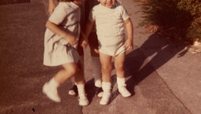 Vintage photography of a picture of three italian children dressed with the 70's style