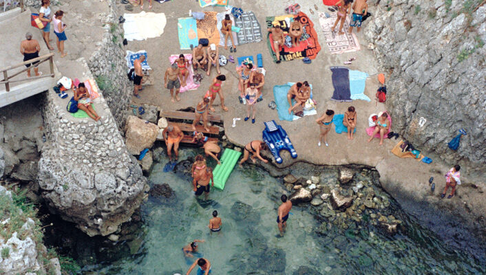 Crowded beach with blue sea in Italy