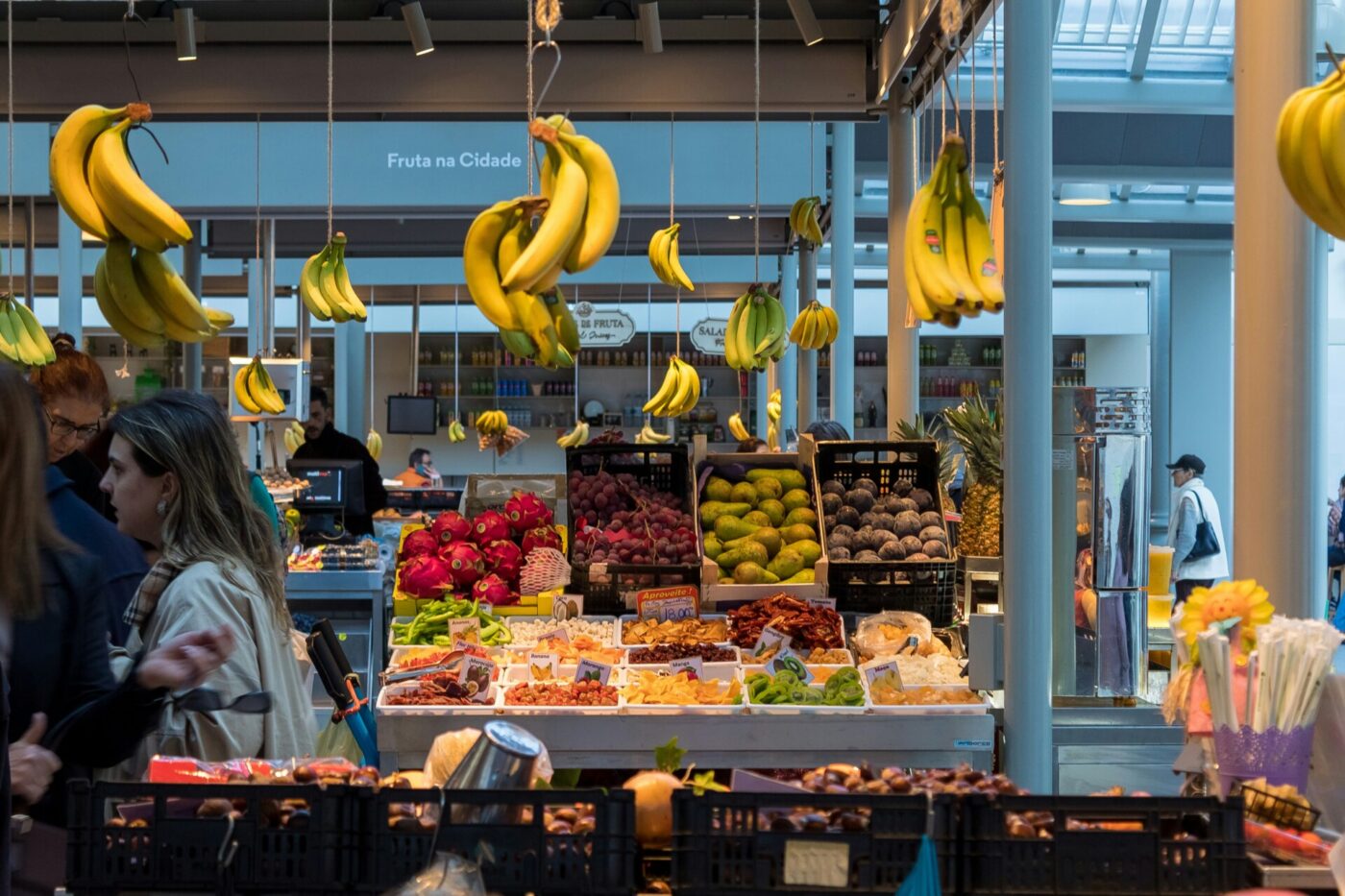 fruit stand with hanging bananas in a market in rome