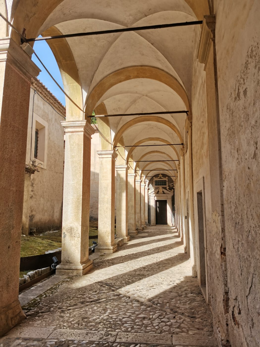 A Day in Certosa: A Peaceful Walk through Certosini’s Mysteries certosa di padula campania view italian architecture photography aesthetics italian landscape view light street via vicolo symmetric