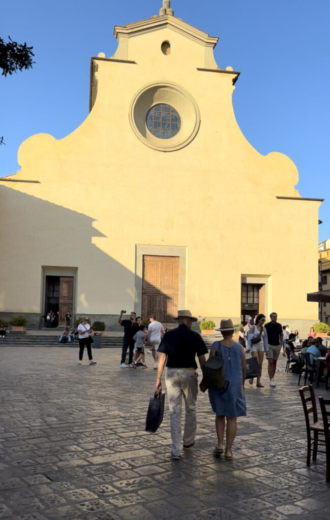 the sun shining on the big, empty facade of piazza santo spitiro