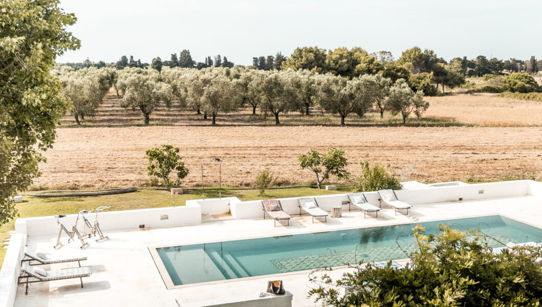 the pool at Masseria Prosperi with olive trees in the background