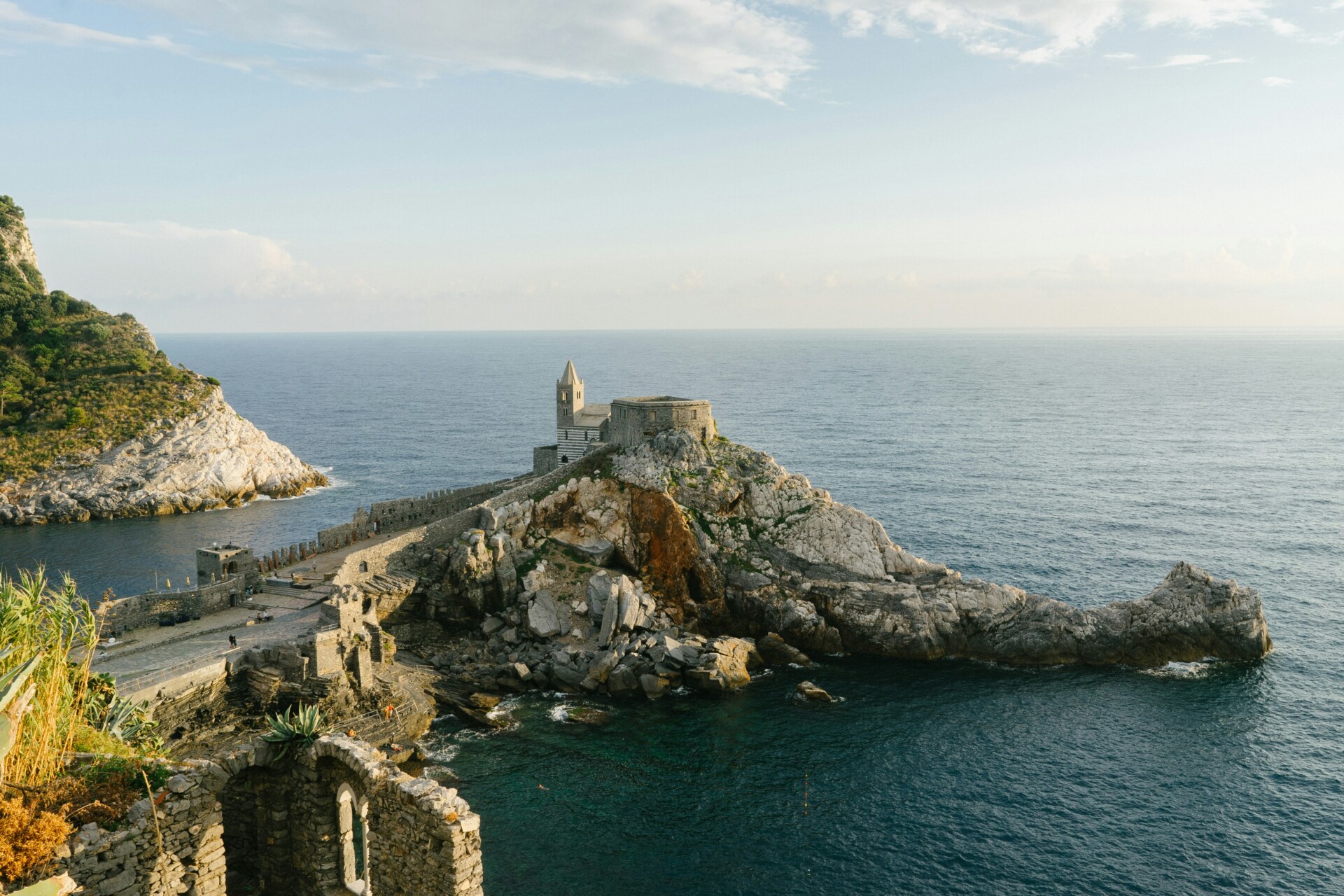 Portovenere out into the water with a beautiful castle among the rocks