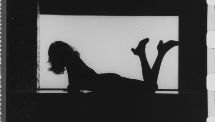 a silhouette of Mina the singer with her legs crossed