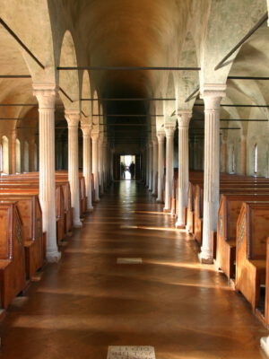 a long row of reading booths in Biblioteca Malatestiana library in Cesena, Italy