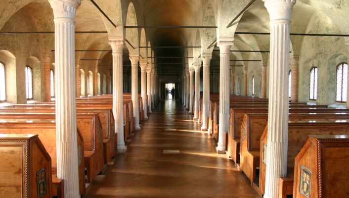 a long row of reading booths in Biblioteca Malatestiana library in Cesena, Italy