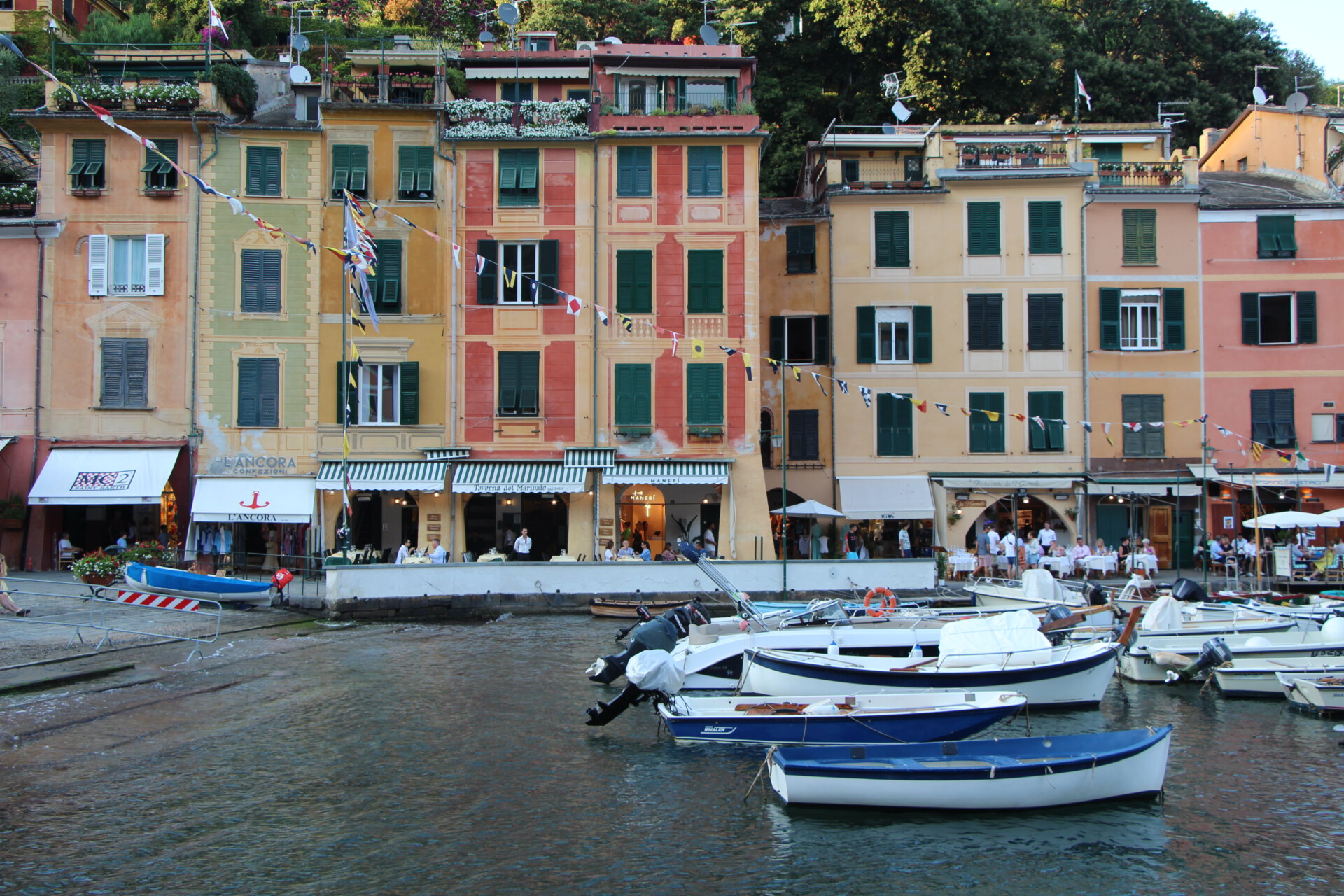 colorful houses along Portofino's port with boats in the water