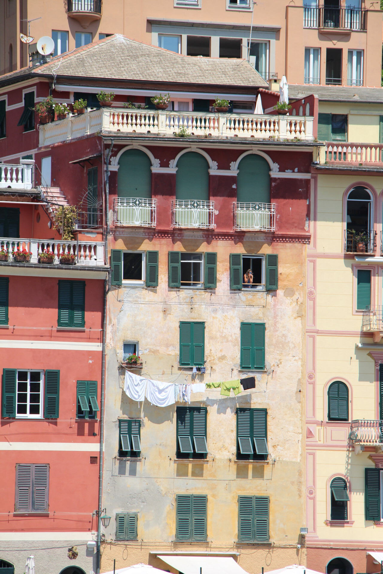 hanging laundry against colored painted house in Portofino