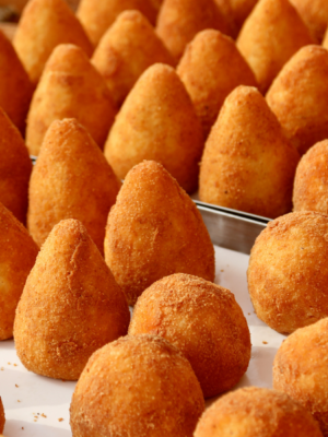 Orange fresh deep fried italian arancini and arancina over bake tray in italian restauran
