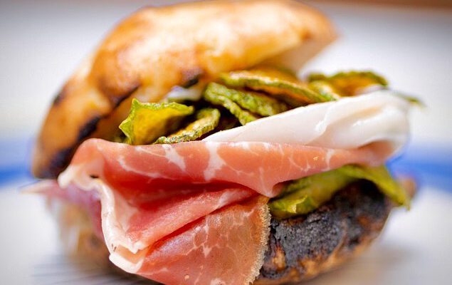 Sandwich with prosciutto crudo and zucchini over roasted bread at Concettina ai Tre Santi restaurant in Naples Campania in Italy