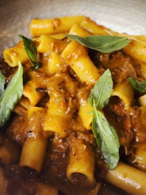 Ziti pasta alla genovese with creamy sauce and basil leaves at Mimi Alla Ferrovia in Naples Campania in Italy