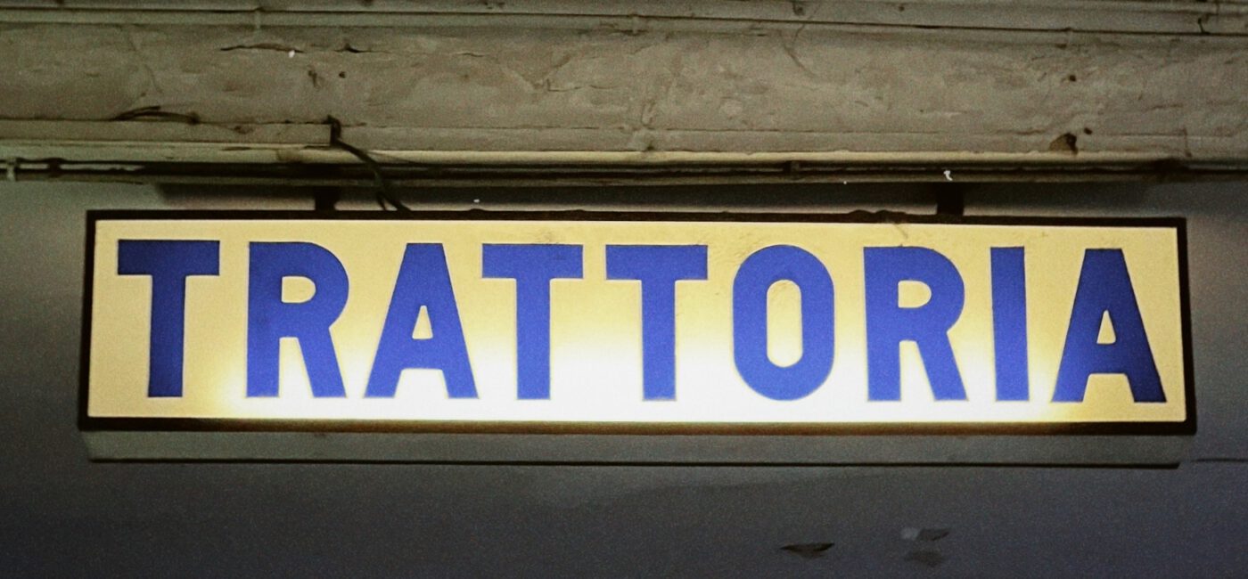 Old traditional trattoria restaurant sign in Bologna Emilia Romagna in Italy