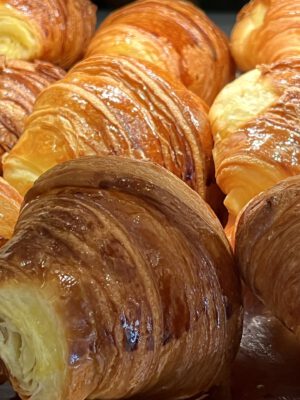 Italian cornetti pastry croissants shinning in a typical italian bar