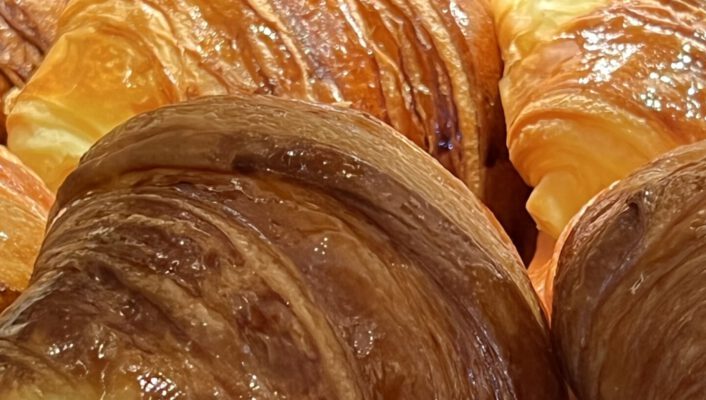 Italian cornetti pastry croissants shinning in a typical italian bar