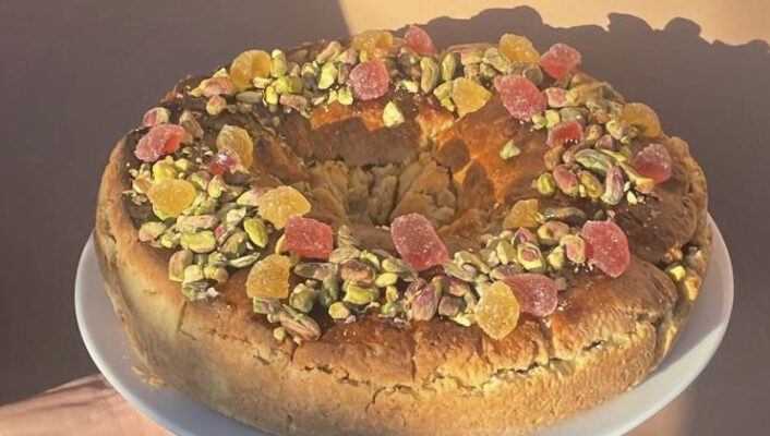 Round sicilian cake with pistacchios and dried fruits under the sun
