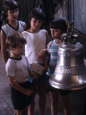children children curious about Marcinelli copper bell