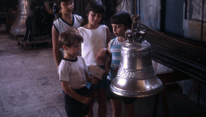 children children curious about Marcinelli copper bell