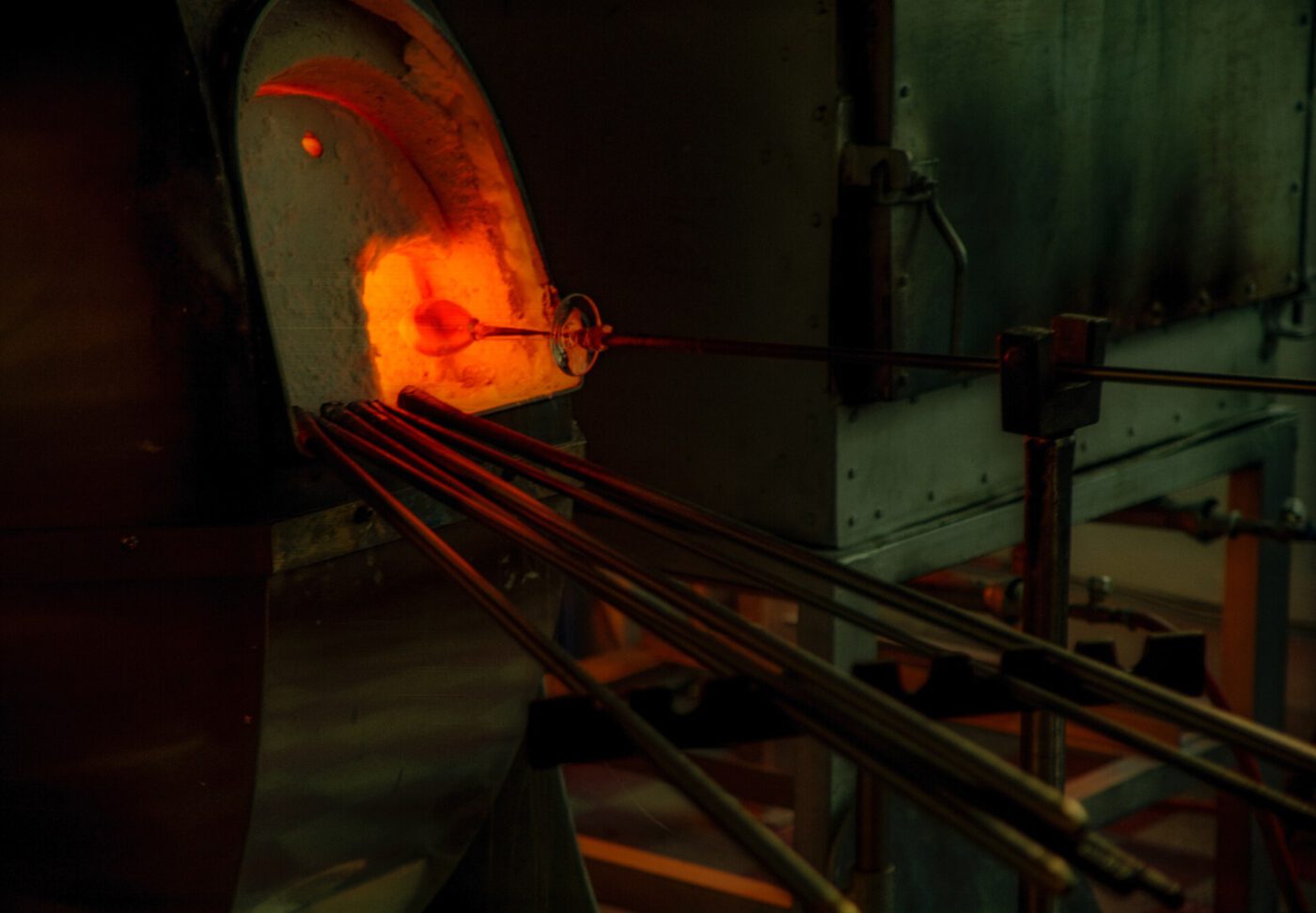 man pulling blown glass out of furnace in Venice
