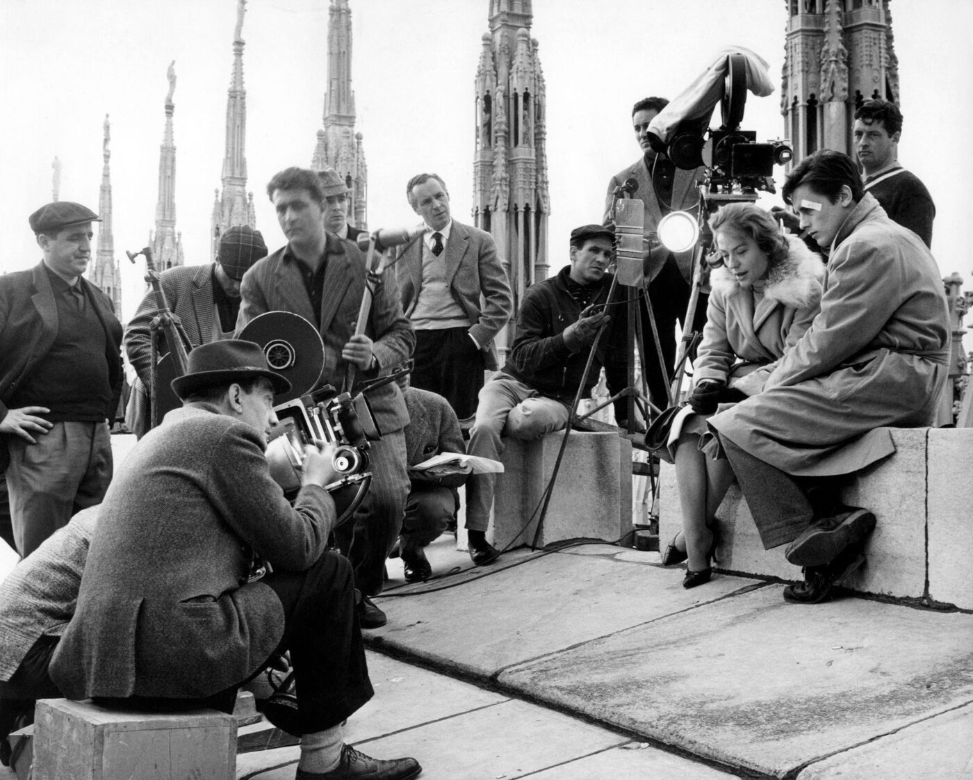 Renato Salvatori and Annie Girardot with director Luchino Visconti on the set of Rocco e i suoi fratelli (1960), a landmark of Italian cinema.