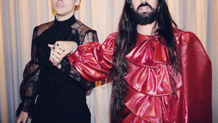 Alessandro Michele in a red top and Harry Styles in black, both Gucci