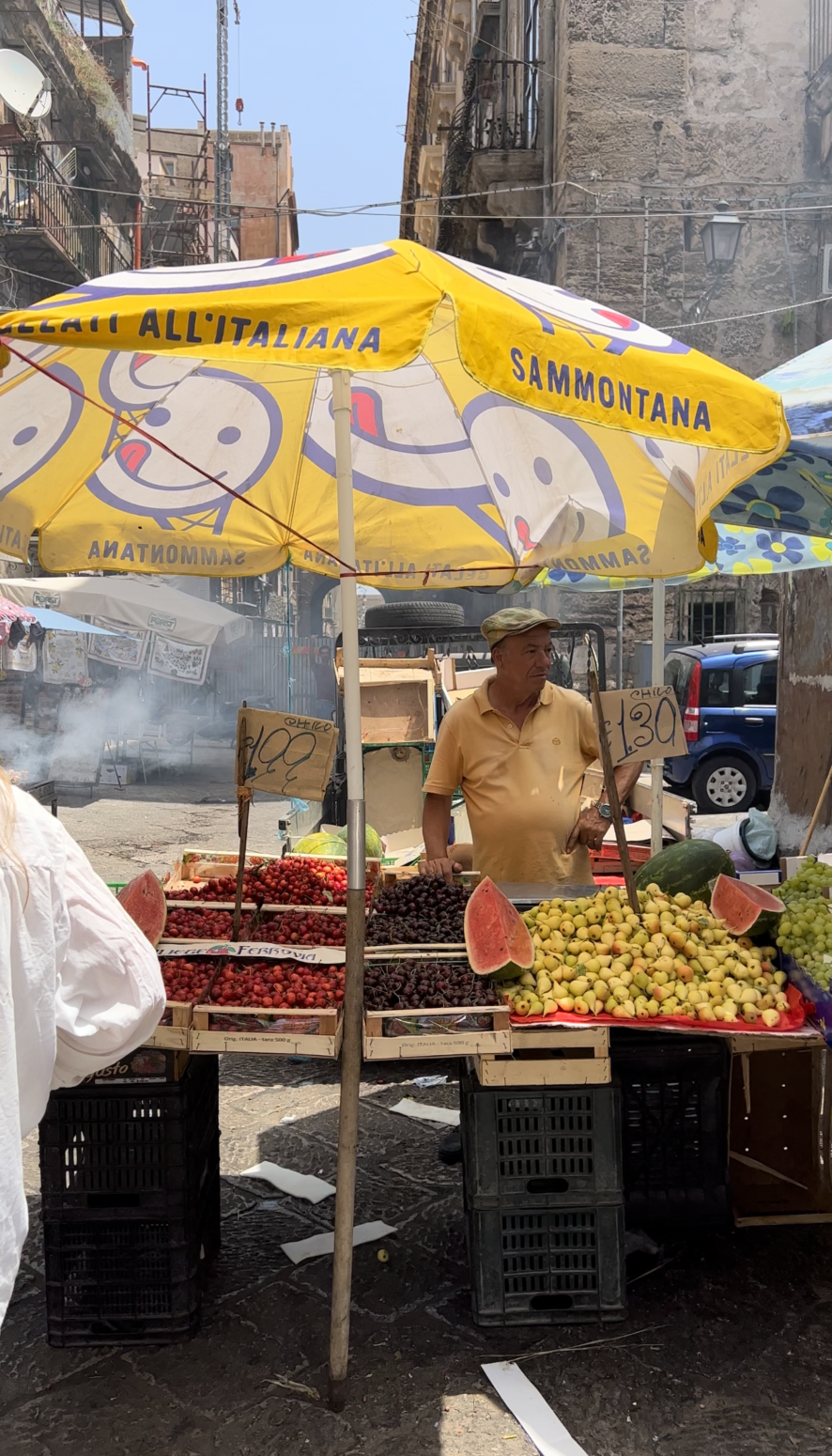 A vendor selling fruit at an outdoor market