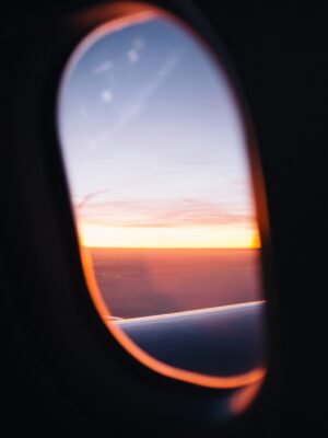 an image of a sunset out of a plane window