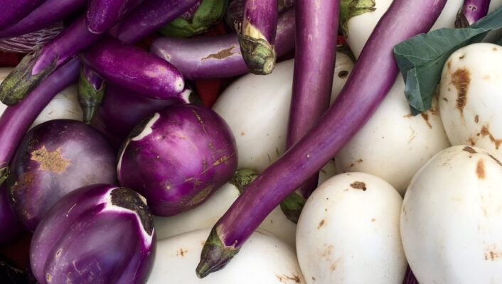a variety of eggplants; white, long, skinny and light purple, dark purple