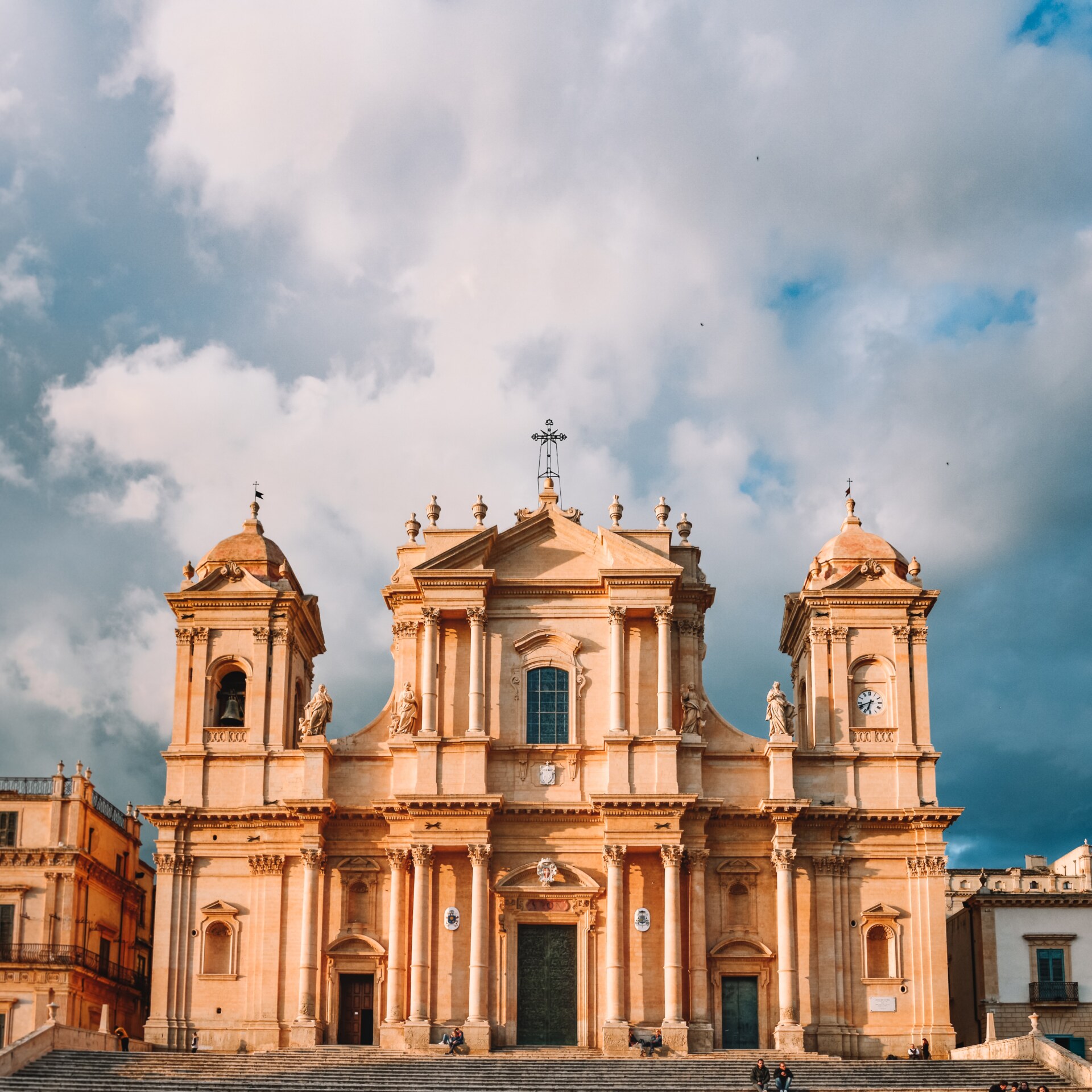 the grand facade of a huge church in Noto, Sicily