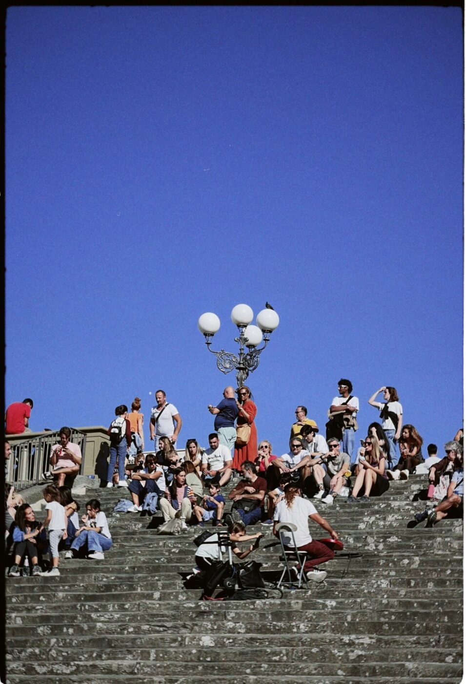 Piazzale Michelangelo in Florence filled with people on a sunny day