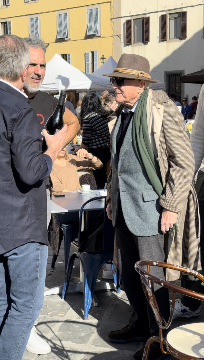 three Florentine men standing outside a caffe in Florence talking