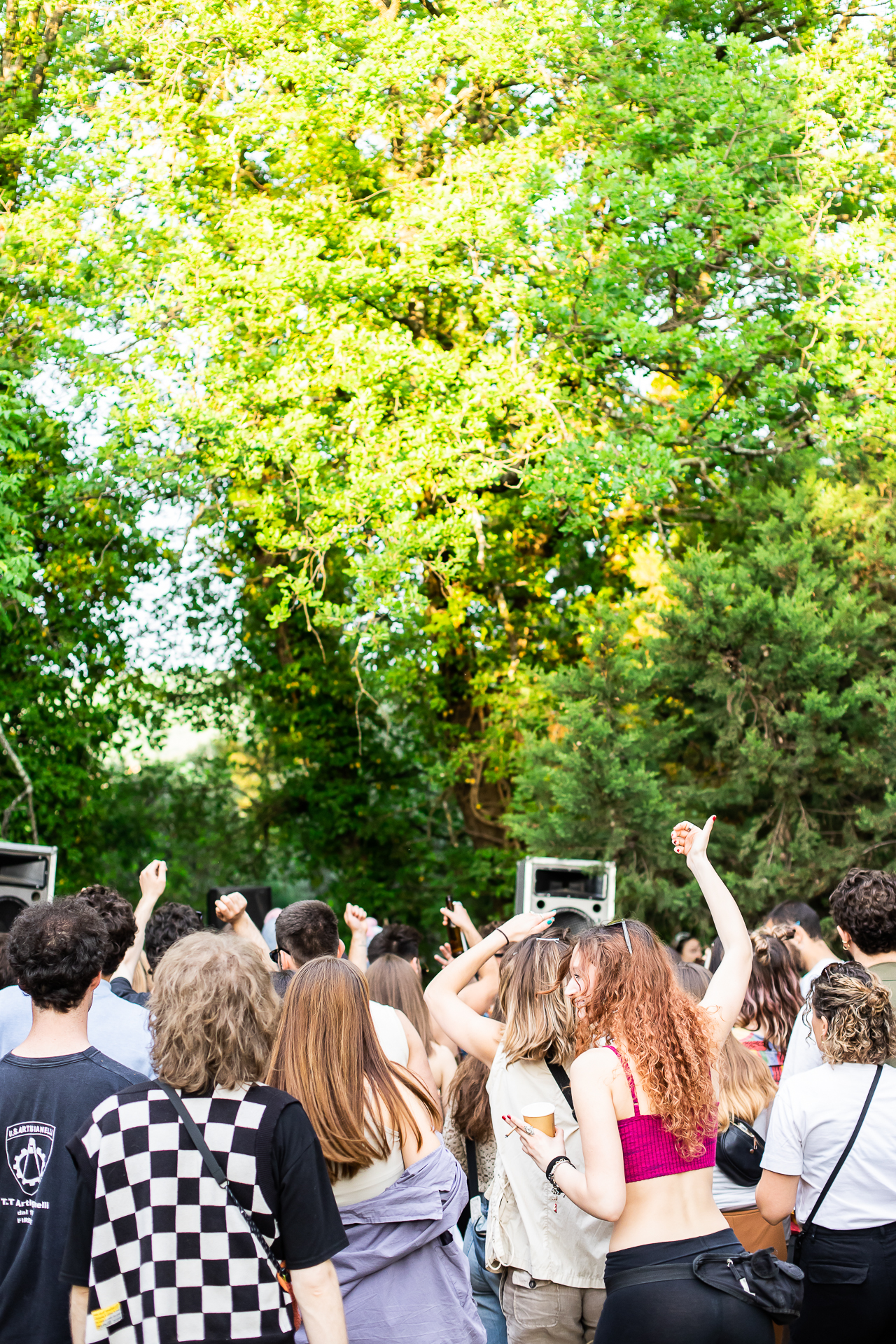 a group of people at an outdoor De Rio DJ set during the day