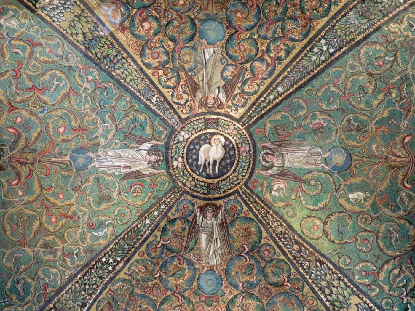 a fresco on the ceiling of a church in Ravenna; four separate panels converging around a circle in the center with four figures and some animal in the center