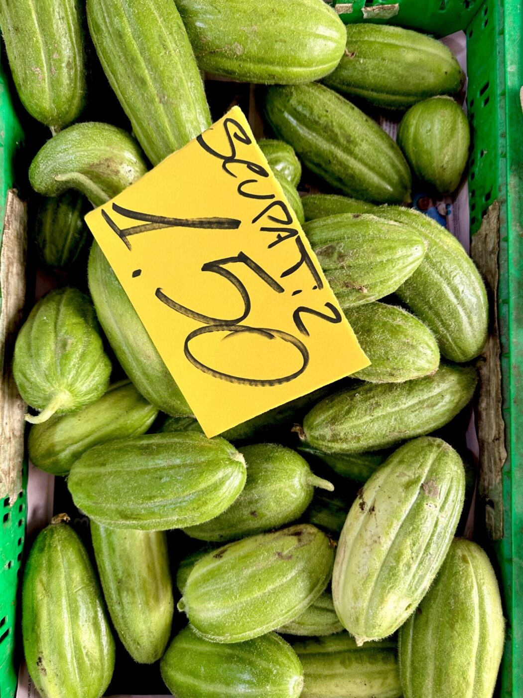 green fruit in a basket at the market in Puglia