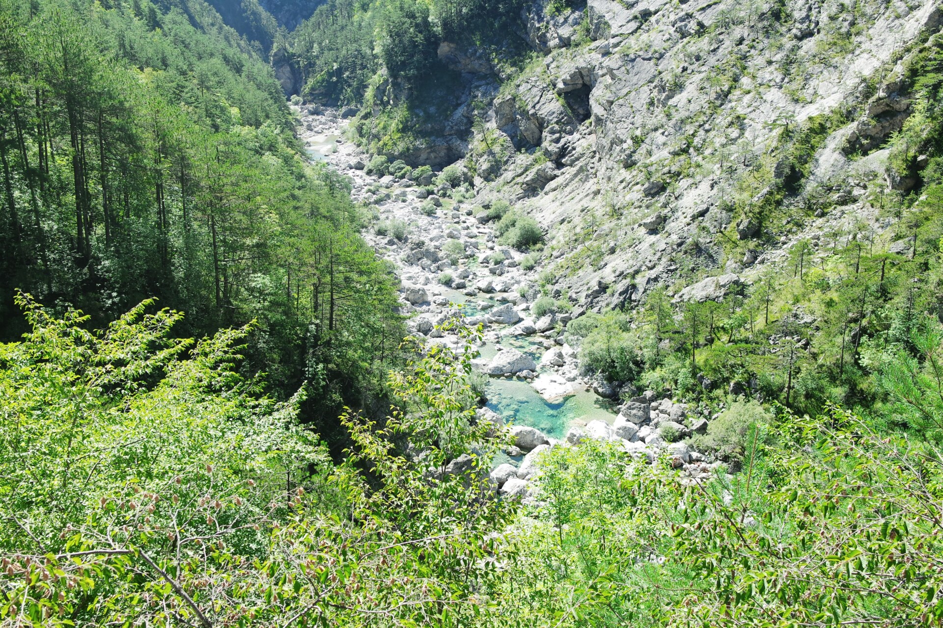 Pozze Smeraldine taken from above, crystal clear water tucked between the dolomites