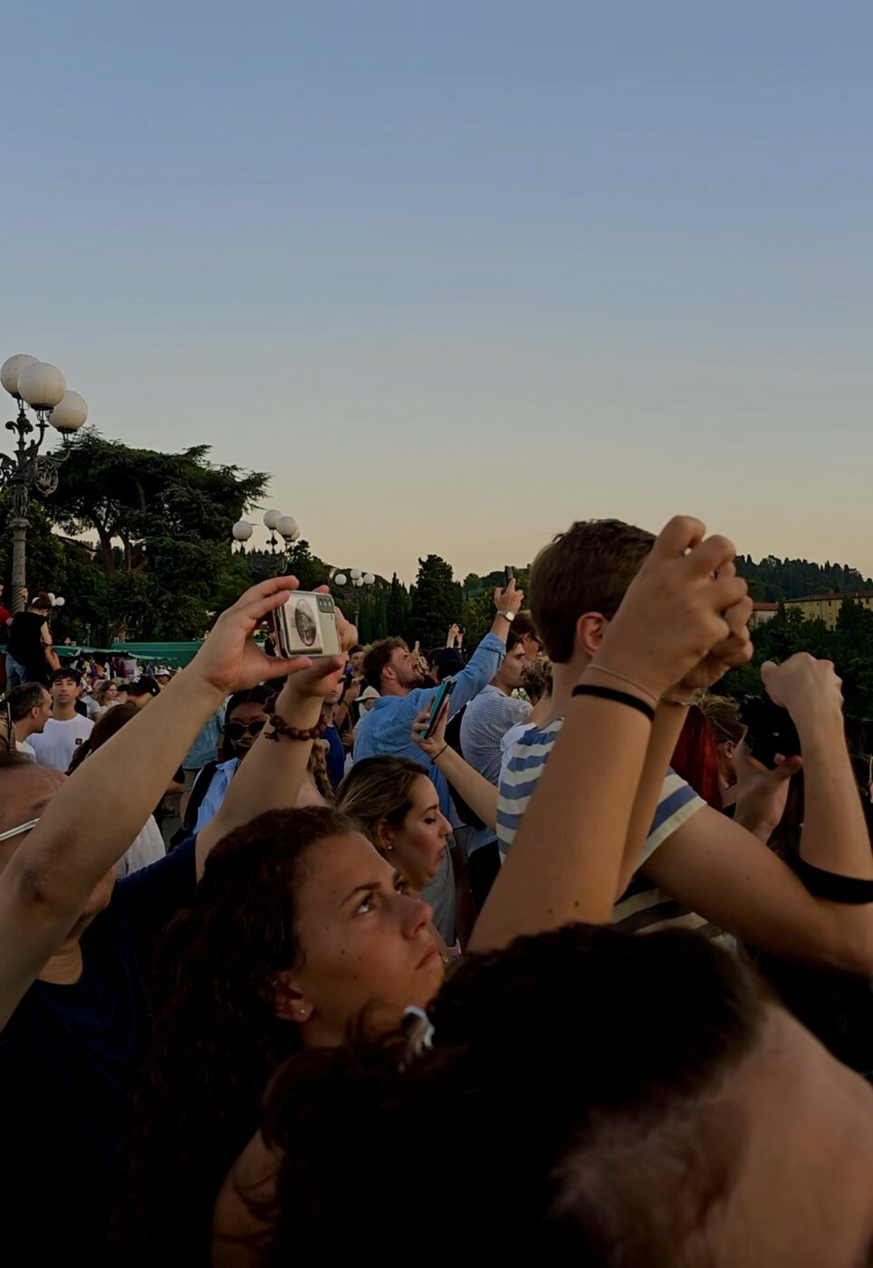 an image of people smushed into a crowded piazza like sardines in a can